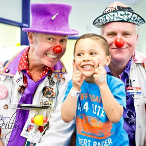 The Clown Doctors cheering up a pint sized patient